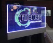 Табличка "Tuborg" 300 х 150 мм, с торцевой подсветкой на стойке. Стоимость 12600 рублей.